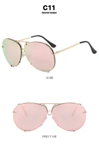 Vintage aviator sunglasses with pink lenses and gold metal frame details