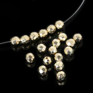 Close-up macro view of golden faceted spacer beads for DIY jewelry making accessories