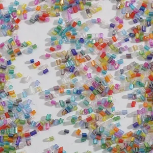 Macro view of colorful 2mm silver-lined glass bugle beads for DIY jewelry making crafts
