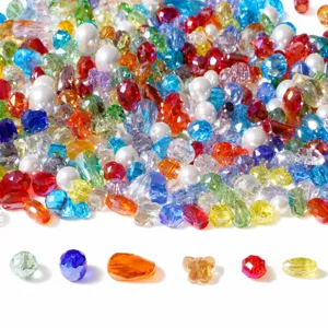 Close-up of colorful faceted glass crystal beads in various shapes for DIY jewelry making