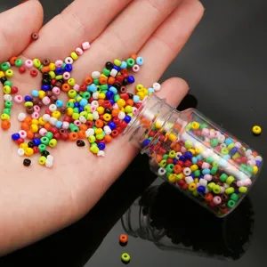Detailed view of colorful 2mm glass seed beads in a bottle for DIY jewelry making