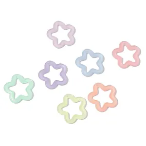 Macro detail of colorful luminous hollow star beads with fine glitter finish for DIY crafts