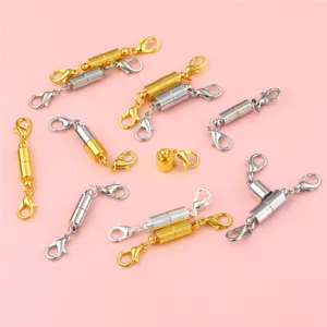 Close-up detail of gold and silver magnetic lobster clasps for DIY jewelry connectors