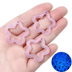 Luminous hollow star charms with fine glitter for DIY jewelry making and crafts