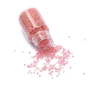 2mm pink glass seed beads in transparent bottle for DIY handmade jewelry crafts.