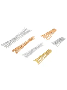 Detailed view of assorted metal T-pins in silver, gold, and rose gold for beading