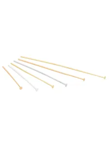 Detail view of assorted metal T-pins in gold, silver, and rose gold finishes.