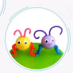 Detail view of adhesive googly eyes on DIY handmade insect toys for kids' crafts