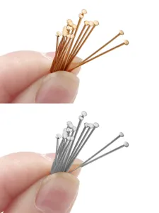 Close-up detail of gold and silver round head T-pins for DIY jewelry making