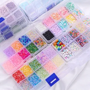 Detailed macro view of colorful DIY jewelry beads organized in clear plastic containers.