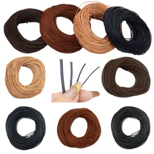 Macro close-up detail of various colored elastic faux leather cords for DIY jewelry making