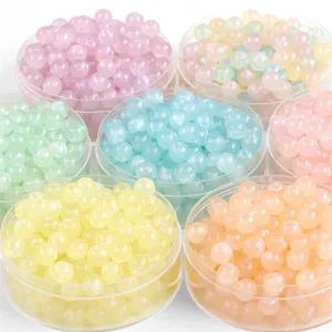 Vibrant collection of colorful iridescent mermaid acrylic beads for DIY jewelry crafting.