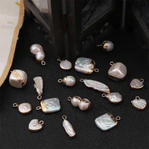 Detail macro view of irregular baroque freshwater pearl pendants with gold-plated metal loops
