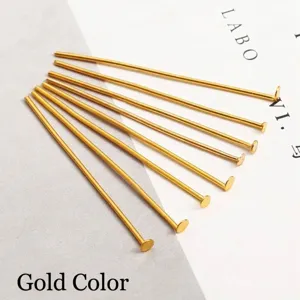 Macro view of golden metal T-pins for DIY jewelry making and beading details
