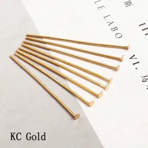 Close-up of golden KC finish T-pins for jewelry making and DIY bead crafts