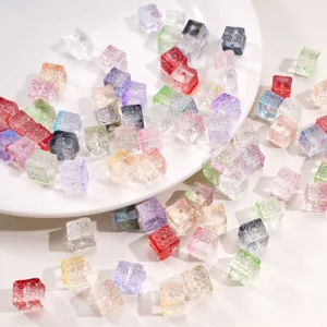 Detailed close-up shot of colorful cracked glass cube beads for DIY jewelry and phone chains.