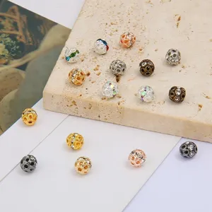 Detailed view of hollow sparkly round beads in various colors for DIY jewelry making.