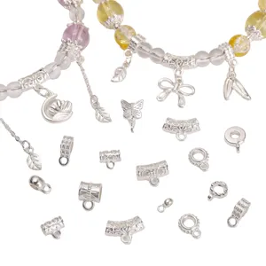 Detailed view of silver alloy beads and charms for DIY necklace and bracelet jewelry.