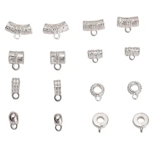 Detailed view of assorted silver alloy jewelry bails and spacer beads for DIY crafts