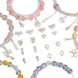Detailed macro shot of silver-plated alloy jewelry bails and spacers for DIY beaded bracelets