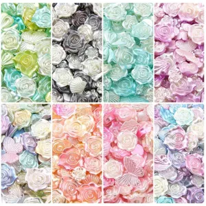 Mixed gradient ABS pearl beads in rose, butterfly, and shell shapes for DIY crafts.