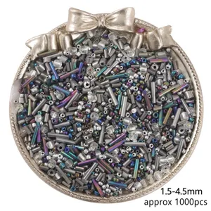 Detailed view of mixed 1.5-4.5mm glass bugle and seed beads in a tray