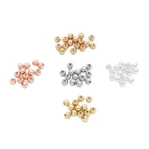 Assorted round copper spacer beads in multiple metallic colors for DIY jewelry making.