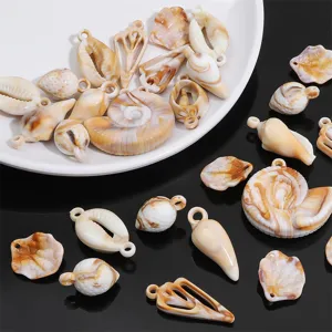 Detailed close-up of marbled acrylic sea shell pendants for DIY bracelet and necklaces