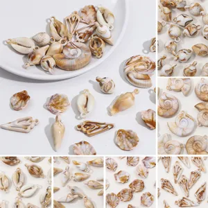 Detailed view of marbled acrylic seashell and conch pendants for DIY jewelry making accessories
