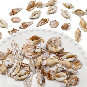 Close-up of mixed acrylic shell pendants with marble texture for DIY jewelry making.