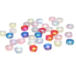 Detailed view of colorful UV-plated acrylic cat-eye flower beads for DIY jewelry