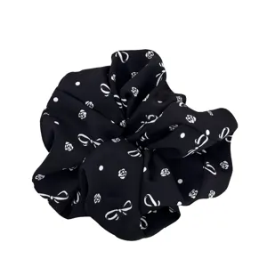 Black scrunchie with white bow and rose prints for ponytail and bun styling