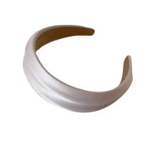 Elegant French style wide padded headband with a pearlescent white satin finish for hair