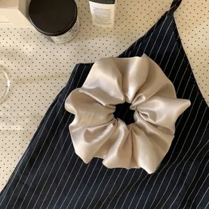 Elegant champagne gold satin oversized scrunchie hair tie accessory for stylish women