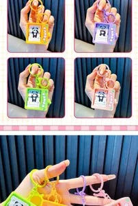 Close-up detail of cute panda flip book animation keychains in four bright colors