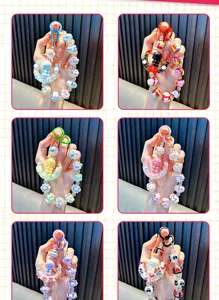 Detailed view of handmade beaded moon girl phone straps available in six vibrant color styles