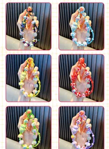 Six colorful variations of beaded cartoon bear phone charms and keychains