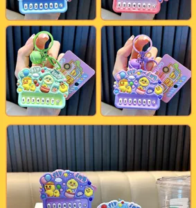 Detailed view of yellow duck piano keychain showing buttons and colorful charms