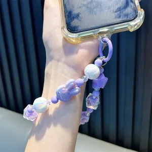 Handmade cute purple bunny beaded phone strap with iridescent beads attached to phone case