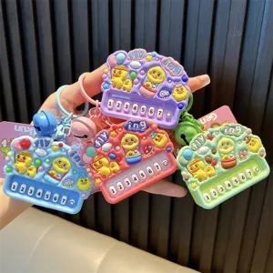 Cute little yellow duck mini piano keychain toy in various vibrant colors