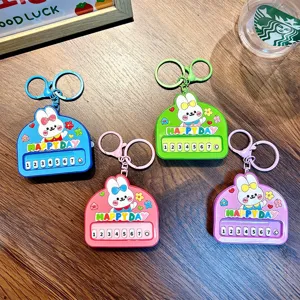 Set of four colorful cute rabbit mini piano keychains in blue pink green and purple colors