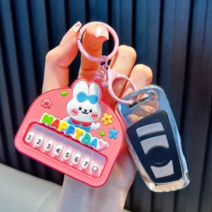 Adorable pink bunny piano keychain featuring numbered keys and HAPPY DAY slogan for bags