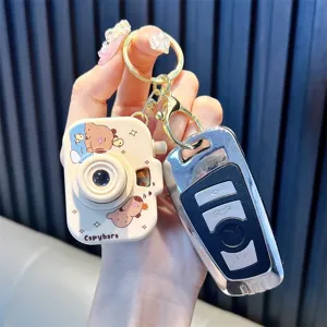 Cute Capybara cartoon projection camera keychain with glowing light-up toy feature