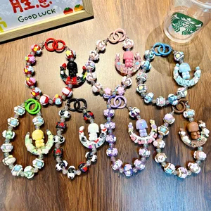 Handmade beaded moon girl phone charms and keychains in assorted vibrant colors
