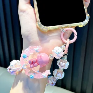 Handcrafted pink moon girl beaded phone strap charm with decorative floral accents