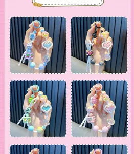 Detailed view of colorful beaded phone charms with pixel-style heart and hand-painted bead accents