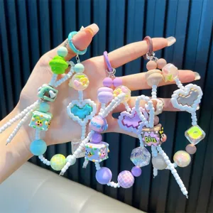 Pastel beaded phone chain with hand-painted heart and cube charms for bags and keys
