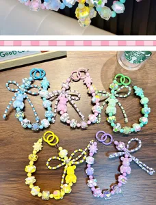 Collection of colorful handmade beaded bear phone charms and keychains in five pastel colors