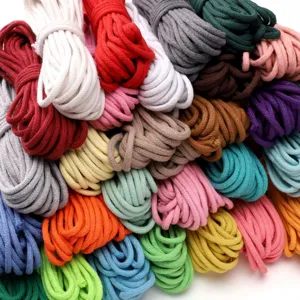 Detail view of various colorful 3/4mm core-spun cotton braided ropes for DIY handmade crafts.