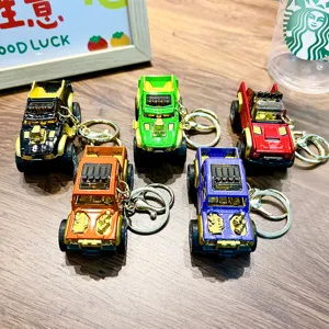 Set of colorful alloy pickup truck keychains featuring pull-back action and metal rings